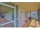 Enclosed lanai with seating and view to the yard at 6107 Marbella Blvd, Apollo Beach, FL 33572