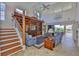 Open-concept living room with high ceilings, built-in shelving, and lots of natural light at 6107 Marbella Blvd, Apollo Beach, FL 33572