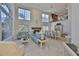 Spacious living room with high ceilings, large windows, a fireplace, and elegant furnishings for comfortable living at 6107 Marbella Blvd, Apollo Beach, FL 33572