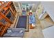 A living room features an open floor plan and a dark blue area rug at 6107 Marbella Blvd, Apollo Beach, FL 33572