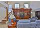 Inviting living room featuring a built-in entertainment center and comfortable seating, creating an ideal space for relaxation at 6107 Marbella Blvd, Apollo Beach, FL 33572