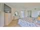 Spacious main bedroom with sleek furnishings, a ceiling fan, and an en-suite bathroom at 6107 Marbella Blvd, Apollo Beach, FL 33572