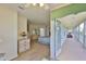 Spacious main bedroom with a view of the long outdoor balcony at 6107 Marbella Blvd, Apollo Beach, FL 33572