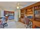 Spacious office with custom wood built-ins and ample storage, perfect for a productive work environment at 6107 Marbella Blvd, Apollo Beach, FL 33572