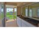 A view of a screened-in outdoor kitchen and patio, perfect for entertaining guests at 6107 Marbella Blvd, Apollo Beach, FL 33572