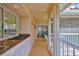 Outdoor kitchen boasts granite countertops and a view through the screened patio at 6107 Marbella Blvd, Apollo Beach, FL 33572