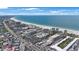 Breathtaking aerial view of the coastline featuring pristine sandy beaches and beachfront properties at 6161 Gulf Winds Dr # 347, St Pete Beach, FL 33706