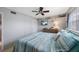 Comfortable bedroom with a TV, soft lighting, and stylish decor at 6161 Gulf Winds Dr # 347, St Pete Beach, FL 33706