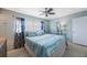Tranquil bedroom with blue accents, and a comfortable, cozy bed at 6161 Gulf Winds Dr # 347, St Pete Beach, FL 33706