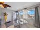 Bright dining area featuring a glass-top table, four wicker chairs, and exterior views at 6161 Gulf Winds Dr # 347, St Pete Beach, FL 33706