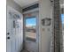 Inviting entryway with 'Beach House' decor, offering a glimpse of the outdoors at 6161 Gulf Winds Dr # 347, St Pete Beach, FL 33706