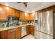 Spacious kitchen boasts stainless steel appliances and ample cabinetry at 6161 Gulf Winds Dr # 347, St Pete Beach, FL 33706