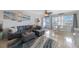 Cozy living area featuring a comfortable sectional sofa, ceiling fan and dining area at 6161 Gulf Winds Dr # 347, St Pete Beach, FL 33706