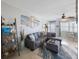 Comfortable living area featuring a sectional sofa, beach artwork, and ceiling fan at 6161 Gulf Winds Dr # 347, St Pete Beach, FL 33706