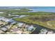 Aerial view showcasing waterfront homes nestled amidst lush greenery and scenic waterways at 6186 Seaside Dr, New Port Richey, FL 34652