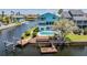 Stunning waterfront home with a pool, private dock, and lush landscaping along the canal at 6186 Seaside Dr, New Port Richey, FL 34652