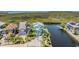 Aerial view of property featuring lush landscape and waterway access with private dock at 6186 Seaside Dr, New Port Richey, FL 34652