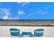 Charming beach setup with seating, perfect for enjoying the serene ocean views at 6186 Seaside Dr, New Port Richey, FL 34652
