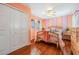 Cheerful bedroom with wood floors, white closet doors, and a coordinating bed set at 6186 Seaside Dr, New Port Richey, FL 34652