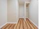 Walk-in closet featuring hardwood floors and wire shelving for organized storage at 6186 Seaside Dr, New Port Richey, FL 34652