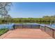 View from deck overlooking serene backyard waterway, creating a peaceful outdoor living space at 6186 Seaside Dr, New Port Richey, FL 34652