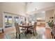 Open dining area with access to a lanai and featuring views of the kitchen and living spaces at 6186 Seaside Dr, New Port Richey, FL 34652