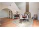 Inviting dining room with hardwood floors, a round table, and a cozy fireplace at 6186 Seaside Dr, New Port Richey, FL 34652