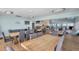Bright dining area with tables, chairs, and a relaxing lounge space adjacent to the bar at 6186 Seaside Dr, New Port Richey, FL 34652