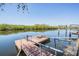 View of long dock on the water providing ample space to enjoy the outdoor views at 6186 Seaside Dr, New Port Richey, FL 34652