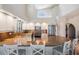 Open concept kitchen featuring granite countertops, white cabinets, and stainless steel appliances at 6186 Seaside Dr, New Port Richey, FL 34652
