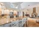 Bright kitchen features granite countertops, stainless steel appliances, and a breakfast bar with seating at 6186 Seaside Dr, New Port Richey, FL 34652