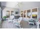 Spacious tiled lanai with comfortable wicker seating, perfect for enjoying outdoor relaxation and views at 6186 Seaside Dr, New Port Richey, FL 34652