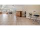 Open living area featuring tile floors, a wet bar, and a comfortable seating area with scenic views at 6186 Seaside Dr, New Port Richey, FL 34652