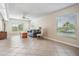 Comfortable living room featuring tile floors, large windows offering scenic views, and cozy furnishings at 6186 Seaside Dr, New Port Richey, FL 34652