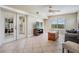 Bright living room featuring tile floors, comfortable seating, and large windows with water views at 6186 Seaside Dr, New Port Richey, FL 34652