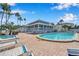 Relaxing pool and lounge area featuring tropical landscaping in a beautiful community setting at 6186 Seaside Dr, New Port Richey, FL 34652