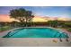 Sparkling pool with waterfront views and lush landscaping, perfect for relaxing and entertaining at 6186 Seaside Dr, New Port Richey, FL 34652