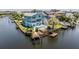 An aerial view showing a home with a private pool and dock along a waterway at 6186 Seaside Dr, New Port Richey, FL 34652