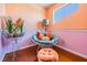 Cozy sitting area with vibrant decor, unique chair, and hardwood floors at 6186 Seaside Dr, New Port Richey, FL 34652