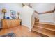 Wooden staircase and artful decor create a welcoming entryway for this home at 6186 Seaside Dr, New Port Richey, FL 34652