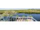 Tranquil water view from the home, featuring a private dock and serene landscape at 6186 Seaside Dr, New Port Richey, FL 34652