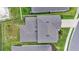 Aerial view of the property showcasing the roof, landscaping, and surrounding neighborhood streets at 6248 Bradford Woods Dr, Zephyrhills, FL 33542