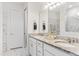 Elegant bathroom featuring double sinks, granite countertops, and marble floors at 6248 Bradford Woods Dr, Zephyrhills, FL 33542