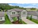 Stylish two-story home showcasing an ample yard and an attached two-car garage at 6248 Bradford Woods Dr, Zephyrhills, FL 33542