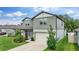 Attractive two-story home boasting a green lawn and a convenient two-car garage at 6248 Bradford Woods Dr, Zephyrhills, FL 33542