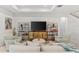Inviting living room featuring stylish decor, comfortable seating, and a large flat-screen television at 6248 Bradford Woods Dr, Zephyrhills, FL 33542