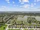 Breathtaking aerial shot of a community alongside a large lake, lush green landscapes, and clear blue skies at 6467 Seasound Dr, Apollo Beach, FL 33572
