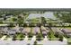 Expansive aerial view of lakeside homes with lush landscaping, private docks, and serene water views in the background at 6467 Seasound Dr, Apollo Beach, FL 33572