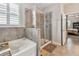 The bathroom showcases a soaking tub and glass-enclosed shower at 6467 Seasound Dr, Apollo Beach, FL 33572