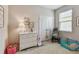 Bright bedroom featuring a dresser, double door closet, and toys at 6467 Seasound Dr, Apollo Beach, FL 33572